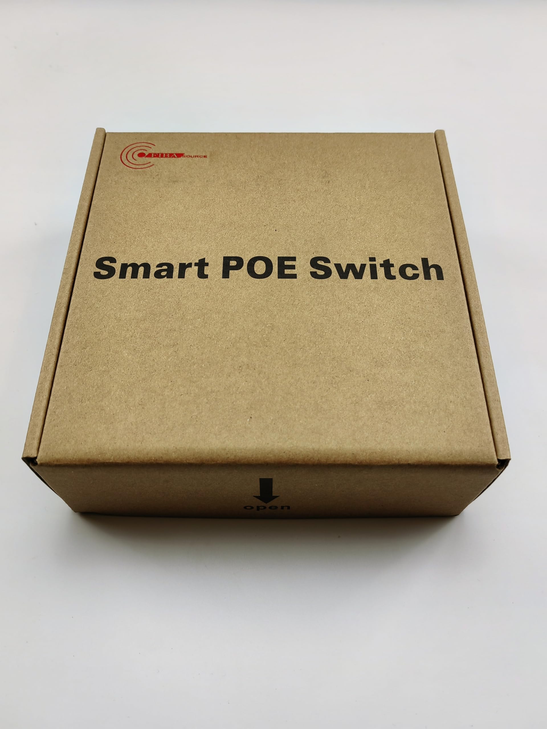 A cardboard box labeled with "5 Port Smart POE Switch, 10/100/1000, BT04G-4+1GE" from FIBAsource Ltd features an arrow pointing down and the word "open" at the bottom. Emphasizing its advanced functionality, this packaging promises high-speed Ethernet switching with RJ45 ports. Set against a plain white background, it invites you to discover its potential.
