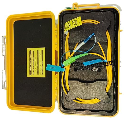 Product Description: The FIBAsource OTDR Launch Cable kit provides a yellow protective case that contains coiled yellow cables with blue and green connectors, tailored for telecom technicians executing fibre optic measurements. This setup is securely housed within a black foam insert, where labels with codes are also visible. Brought to you by FIBAsource Ltd, the kit features a 1km SC/APC to LC/UPC Single Mode Fibre Optic Extension Cord designed for precise network testing.