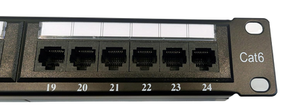 Close-up of the FIBAsource Ltd. Patch Panel 24 Port, 10G Support, 19-Inch Punch Down; shows Ethernet ports labeled 19-24 with blank white labels—ideal for high-speed connections.