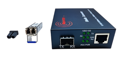 A SFP Ethernet Media Converter with POE Function from FIBAsource Ltd, equipped with multiple ports such as Ethernet and fiber optic connections, rests on a white surface. Next to it are a power adapter and a small connectivity attachment that support transmission rates of 100/1000Mbps.